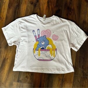 Ideal T by Next Level | Care Bears Grumpy Ramen Bowl Cropped Tee | Medium